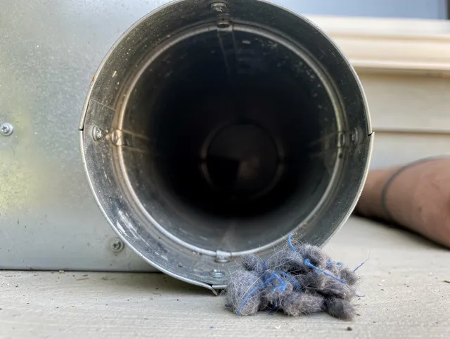 Del Aire Dryer Vent Cleaning technician using specialized equipment to clear severe dryer vent blockage in Del Aire